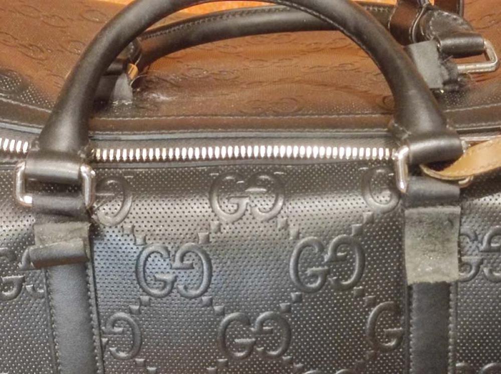 Réparation anse usée sac de voyage Gucci avant